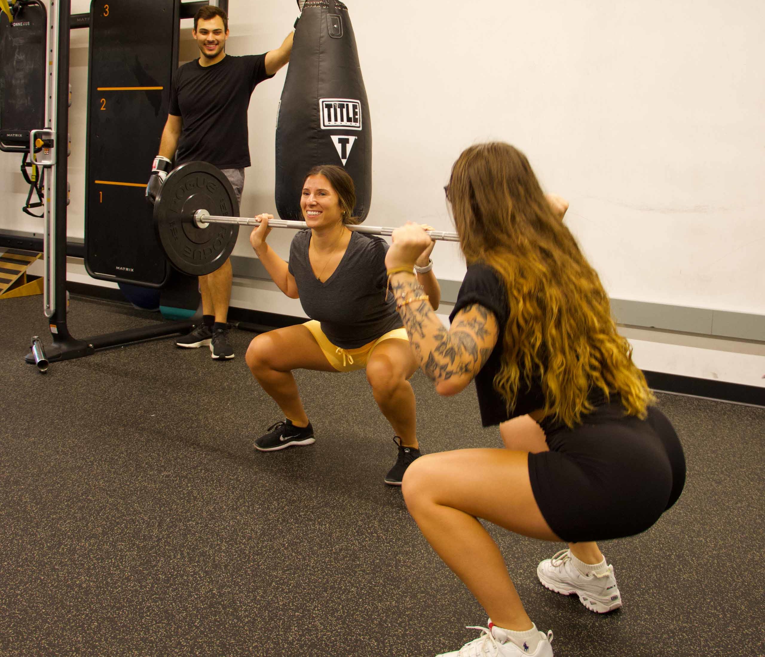 A woman receiving personal training in functional fitness.