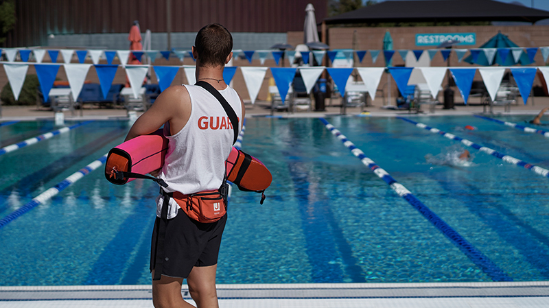 A lifeguard at a pool.